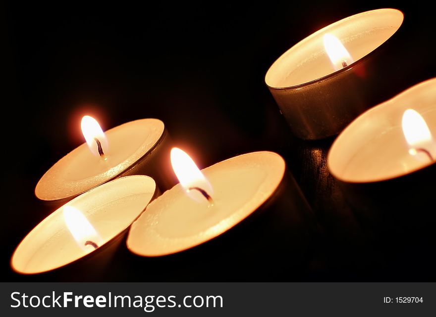 A candles over black background