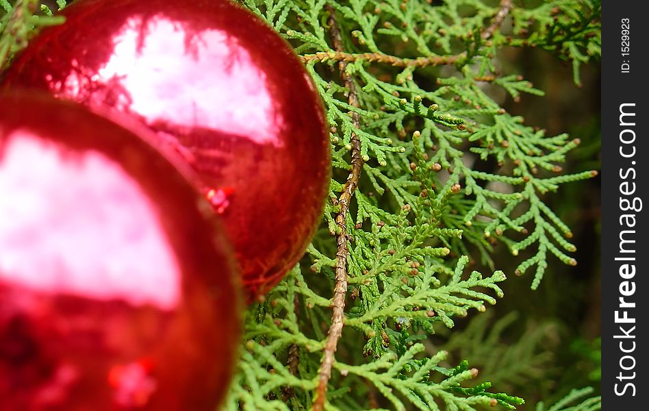 Christmas tree balls with Santa Claus reflected by the light