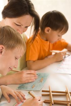 Young Mother Drawing With Her Sons Stock Image Young Mother Drawing With Her Sons Stock Image