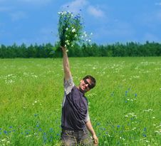 Young Adult Man With Bouquet Of Wildflowers Stock Photography Young Adult Man With Bouquet Of Wildflowers Stock Photography