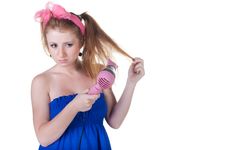 Red-haired Girl With The Hair Dryer. Royalty Free Stock Images