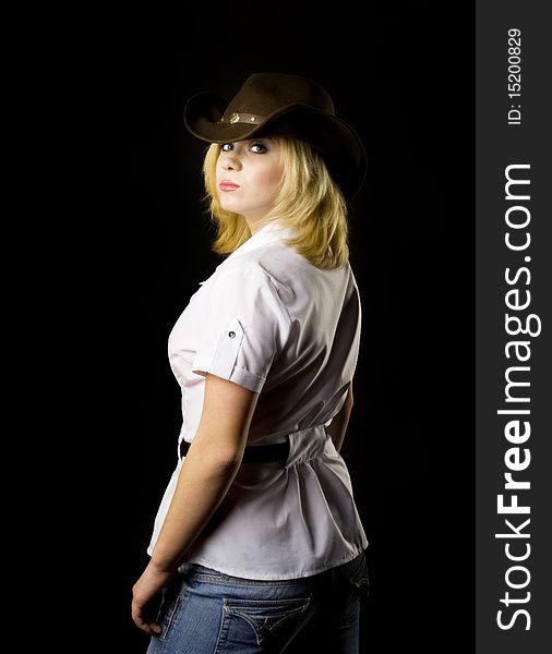 Blond CowGirl - studio shot back view