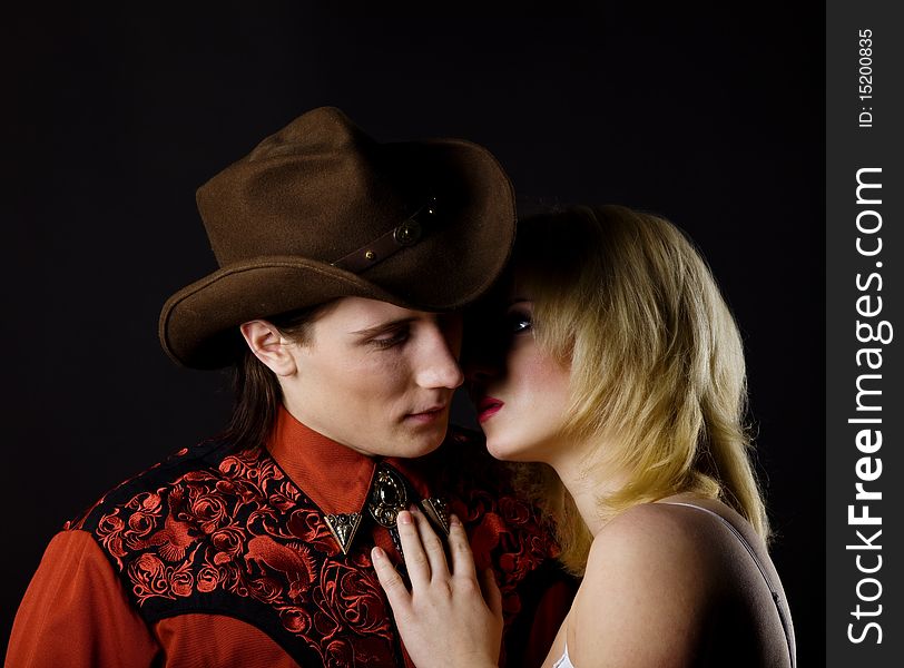 Young boy and girl studio shot cowboy style. Young boy and girl studio shot cowboy style