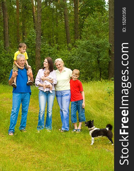 Portrait of a happy family of six on the nature