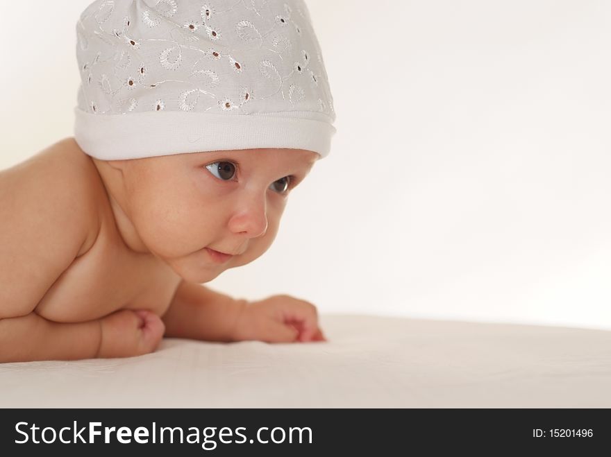 Portrait of a beautiful newborn baby on a white background