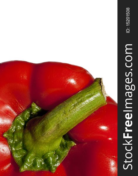 A closeup macro shot of a red bell pepper and its stalk, frontal view with plenty of copy space. A closeup macro shot of a red bell pepper and its stalk, frontal view with plenty of copy space