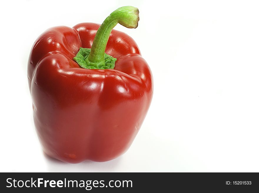 A red bell pepper straight up, isolated on white background with plenty of copy space.