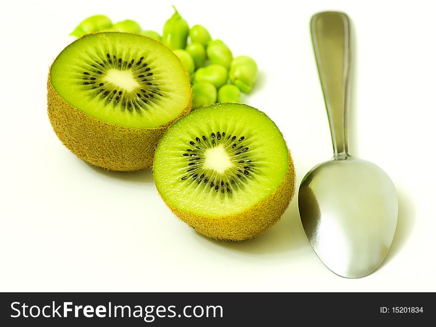 Kiwis with spoon on white background