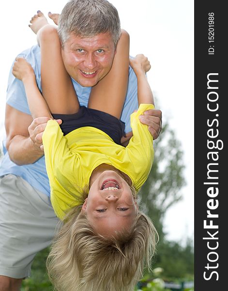 Happy father and daughter in summer park