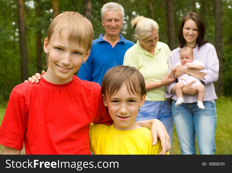 Portrait of a happy family of six on the nature