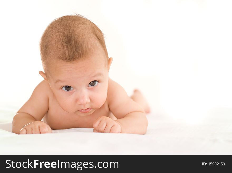 Beautiful newborn baby on a white