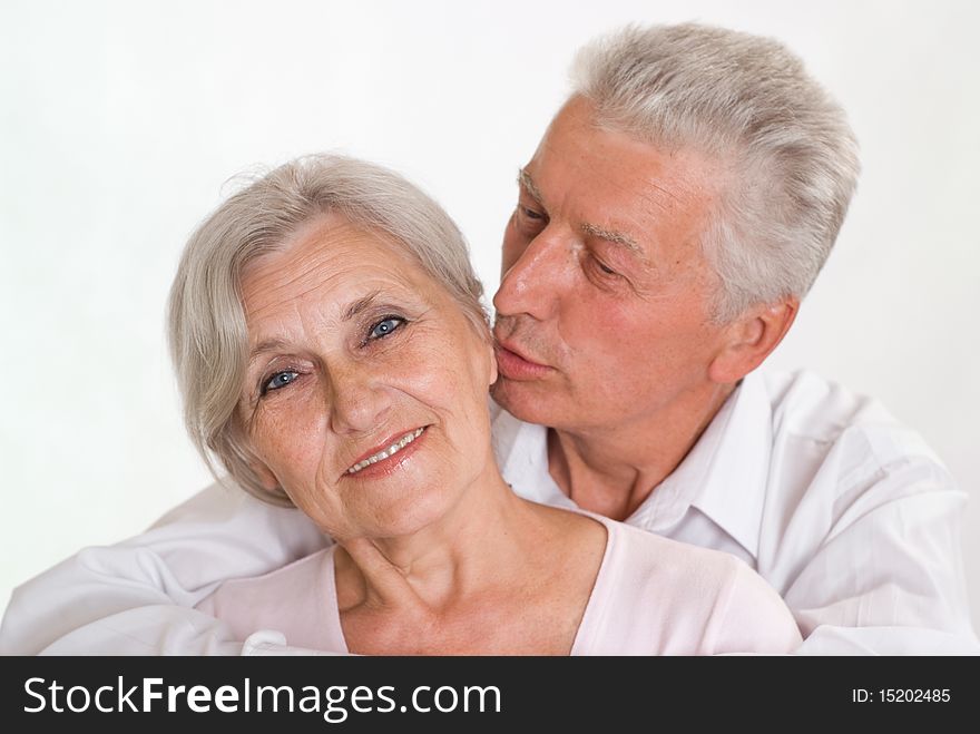 Happy elderly couple together on a white background. Happy elderly couple together on a white background