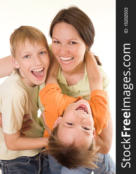 Happy mom and children on a white background