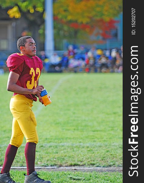 A young African American on the practise field before a game. A young African American on the practise field before a game