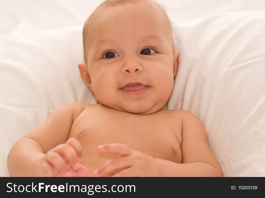 Portrait of a beautiful newborn baby on a white