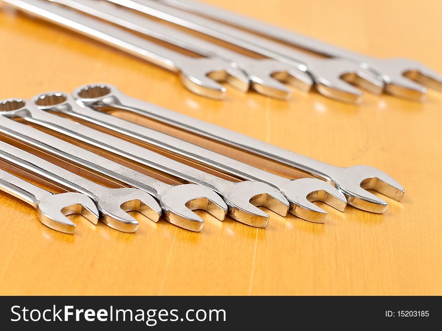 Hand wrenches on wood background. Hand wrenches on wood background