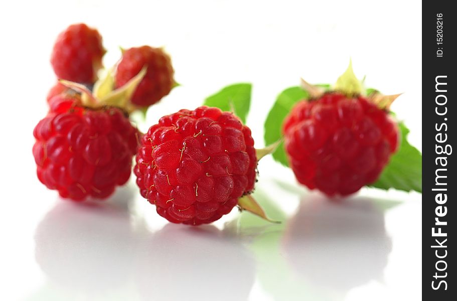 Fresh raspberries on a white background