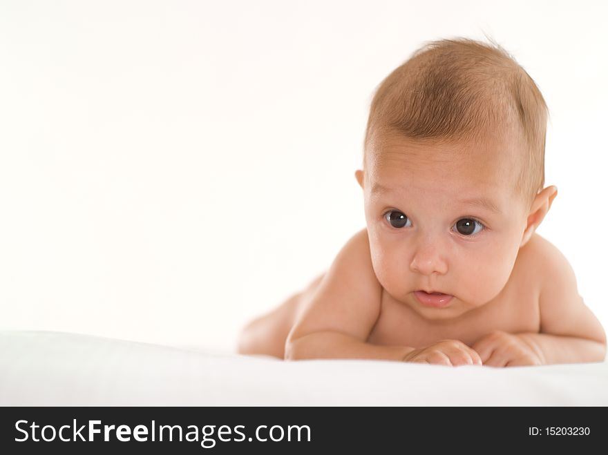 Portrait of a beautiful newborn baby on a white background