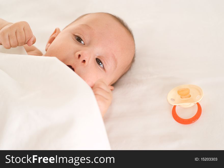 Portrait of a happy newborn  on a white