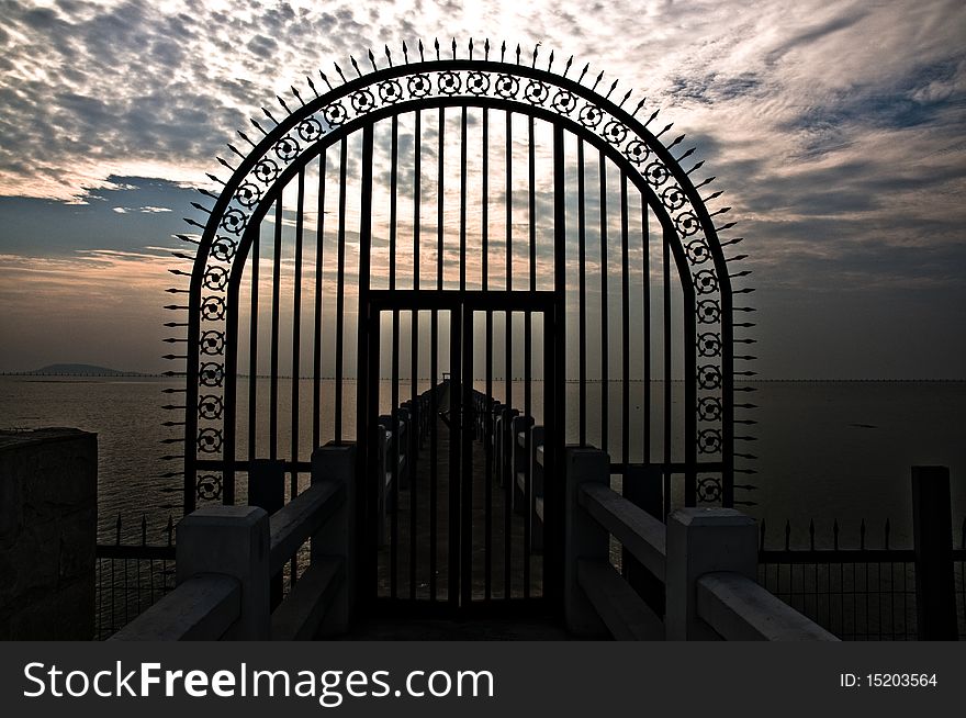 The gate under the cloudy sky
