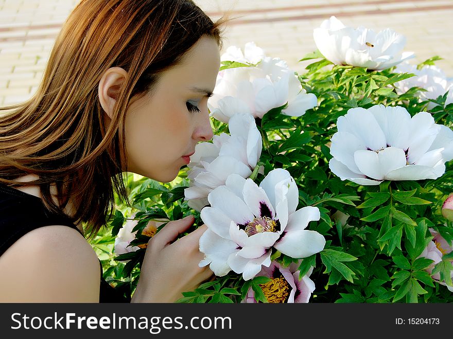 Girl smelling flowers