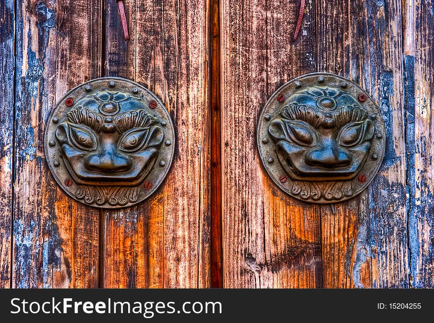 Old metal door knob with animal pattern at Wu Zhen in China. Old metal door knob with animal pattern at Wu Zhen in China