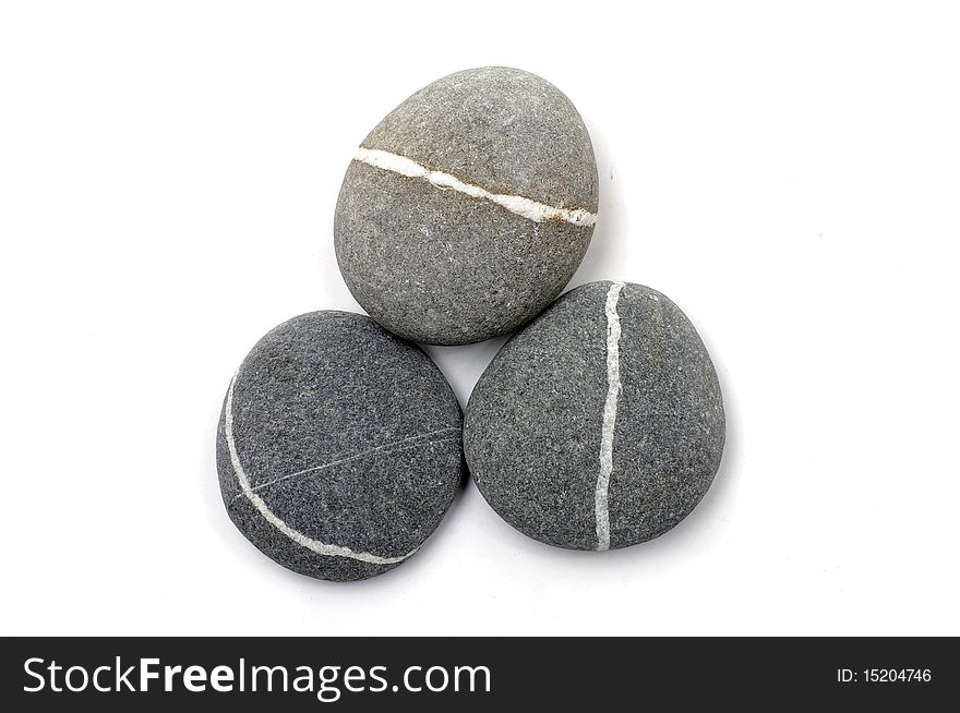 Three stones with white stripes