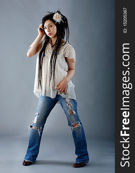 Model poses wearing a vintage top with jeans. Model poses wearing a vintage top with jeans.
