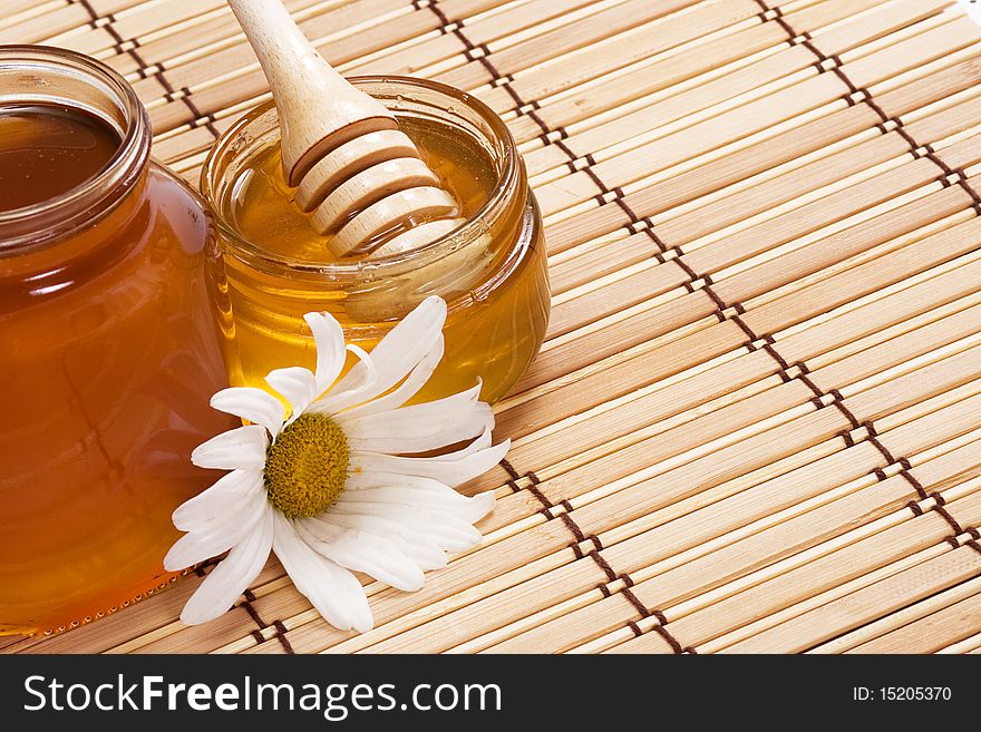 Glass pot full of honey. Glass pot full of honey