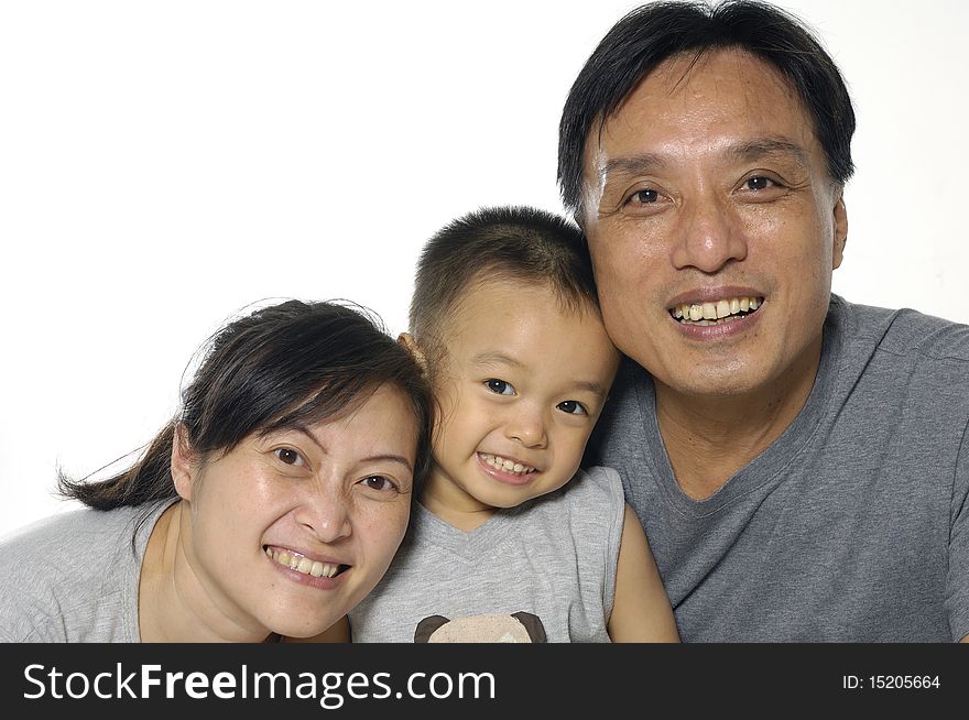 Asian mother, father and little boy. Isolated on white. Asian mother, father and little boy. Isolated on white