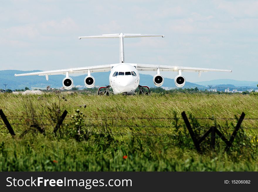 Small airplane waiting on the field