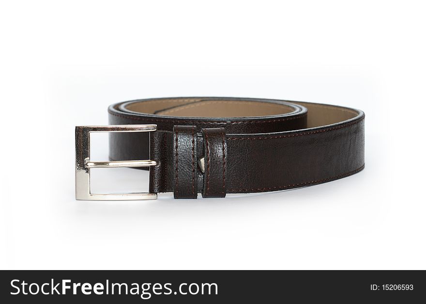 New black leather belt isolated on white background. New black leather belt isolated on white background