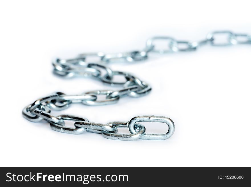 Closeup of long metal chain on white background