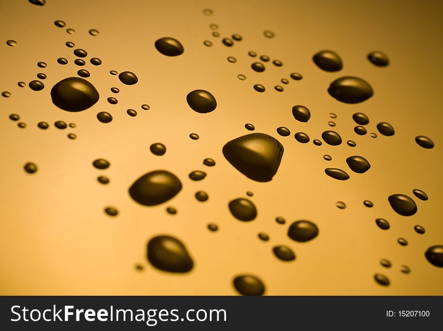 Droplets of water against gold. Droplets of water against gold