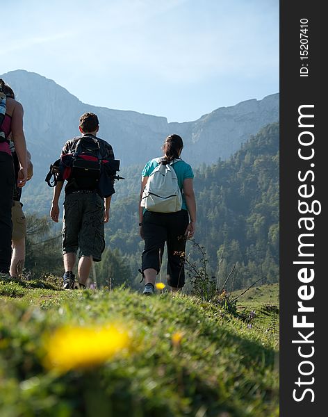 Women and men while hiking in the countryside. Women and men while hiking in the countryside