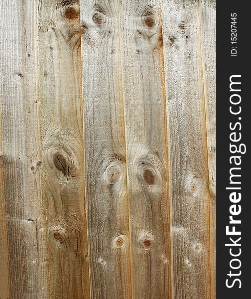 An abstract close up background of a wooden panel fence. An abstract close up background of a wooden panel fence