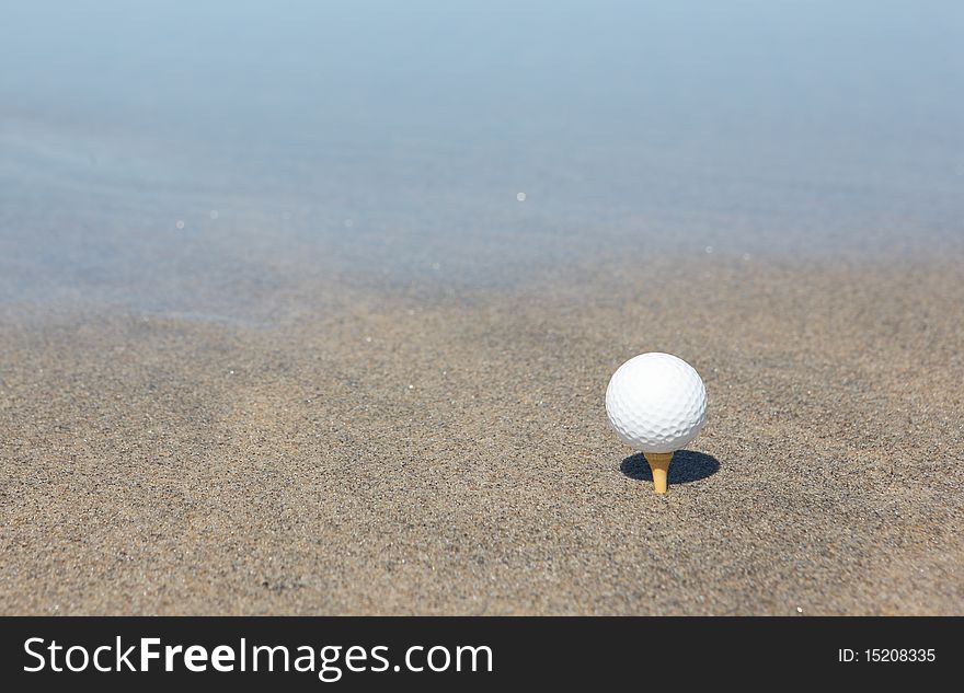 Golf ball in the beach
