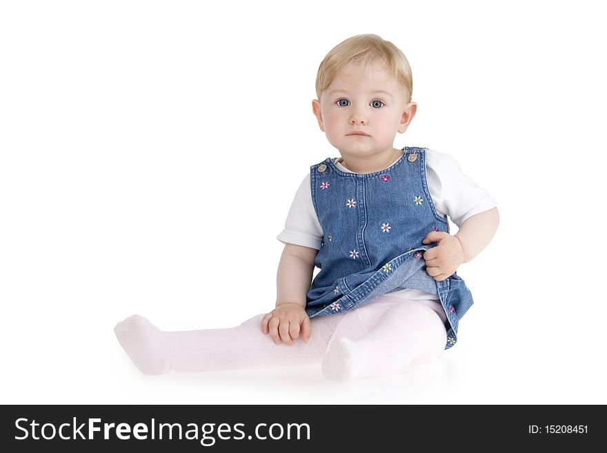 Dinky little girl sitting on white background.