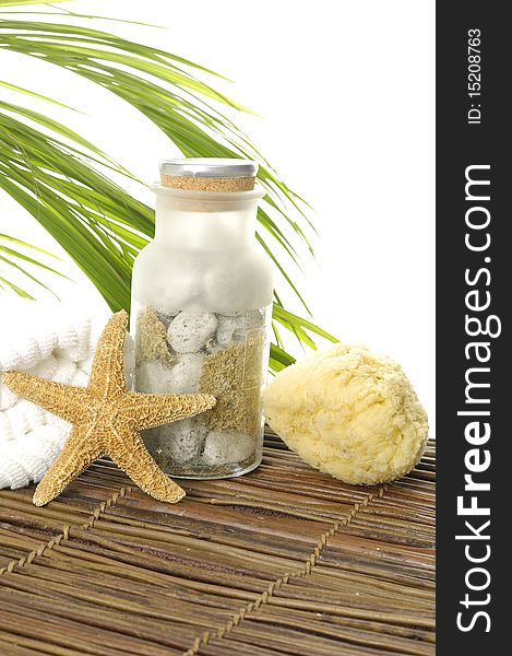 Towel and seashells on bamboo mat. Towel and seashells on bamboo mat