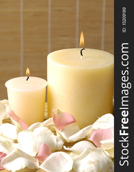 Spa concept. Candles and roses petals