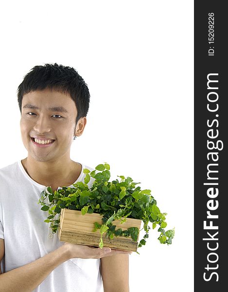 Young man with green plant . focus on green ivy