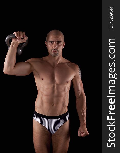 Muscle Young Man With Kettlebells