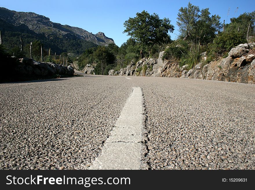 Center line of a country road in the Tramuntana mountains at the island Majorca, Spain