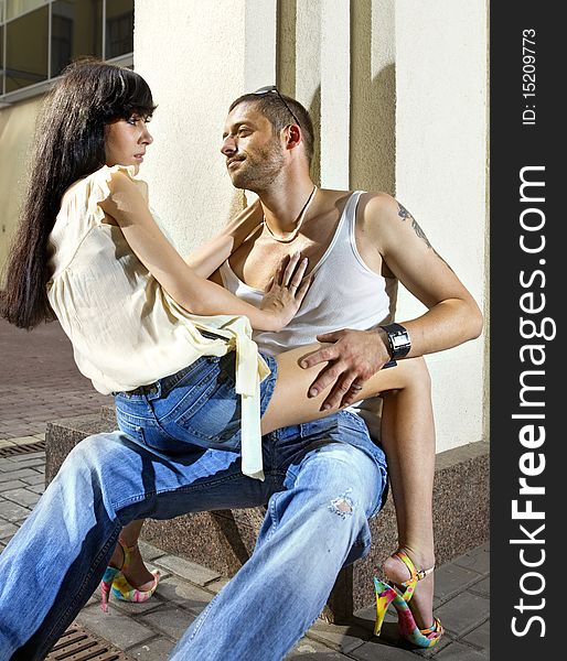 Young couple on the street at summer day