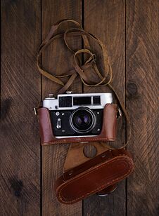 Vintage Old Camera On Rustic Wooden Background. Top View Stock Photos