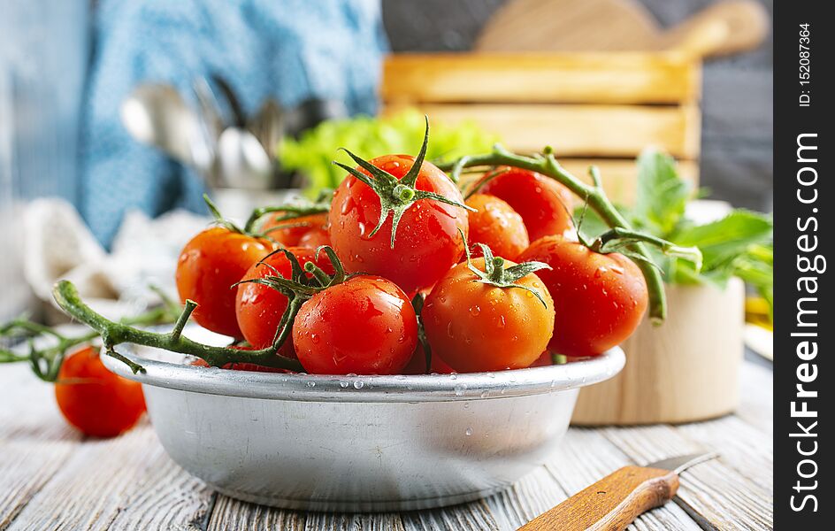 Fresh tomato in metal bowl, fresh tomato for salad