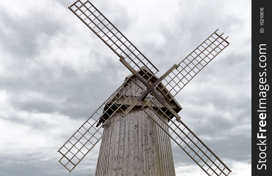 Old windmill against cloudy sky. close-up