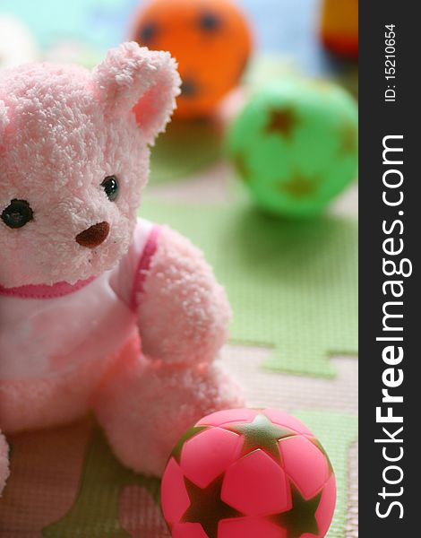 Pink teddy bear and ball