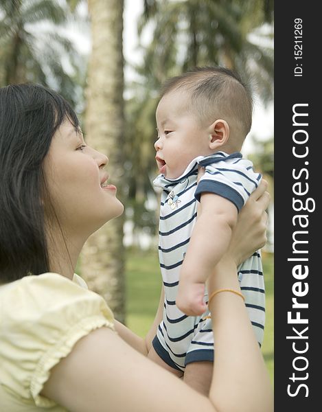 Asian young mother holding baby. Asian young mother holding baby