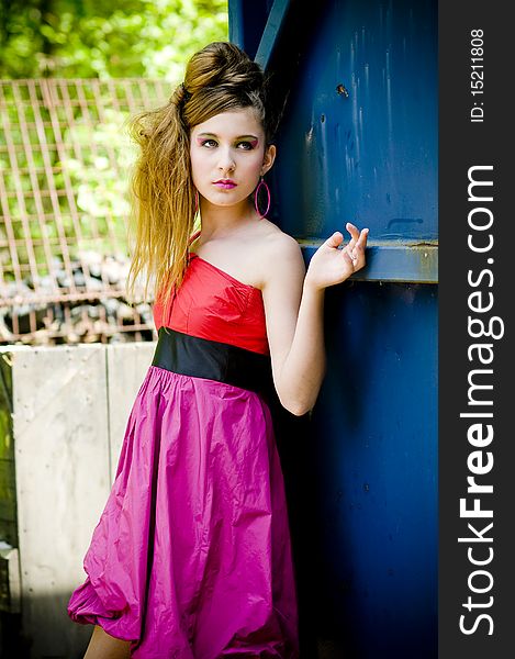 Teenage girl model presenting flashy clothes in old natural background. Teenage girl model presenting flashy clothes in old natural background